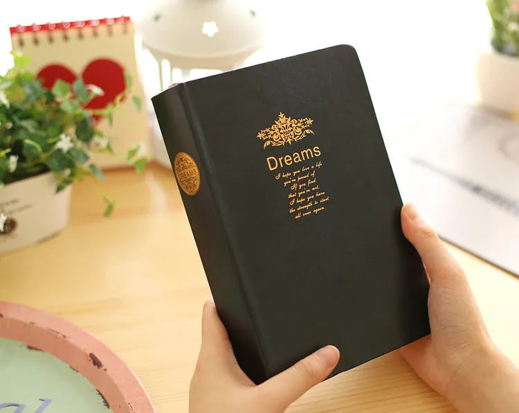 Jingu Super Thick Notebook with imitation leather cover, open showing heavyweight paper and 35mm thickness.