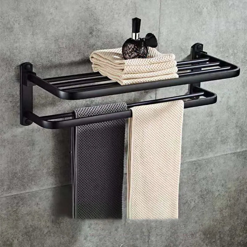 Silver anodised aluminium folding bathroom shelf with two towel racks, shown mounted on a wall.