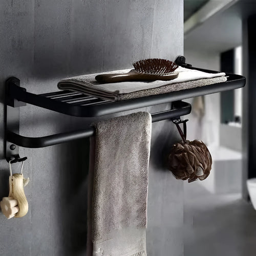 Silver anodised aluminium folding bathroom shelf with two towel racks, shown mounted on a wall.
