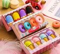 Pack of 12 colourful cartoon erasers shaped like ice cream, donuts, and lollipops for children.