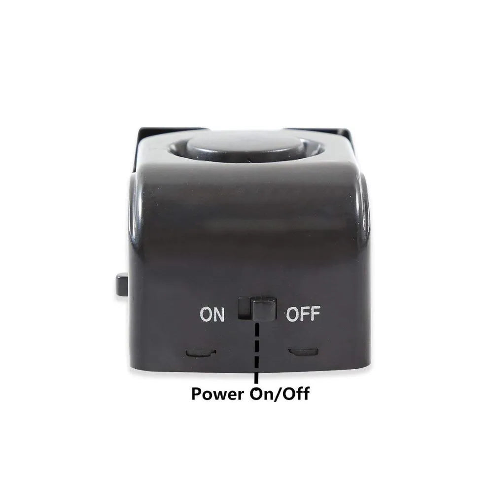 Electronic burglar alarm wedge door stop with ABS housing and 150dB siren on white background