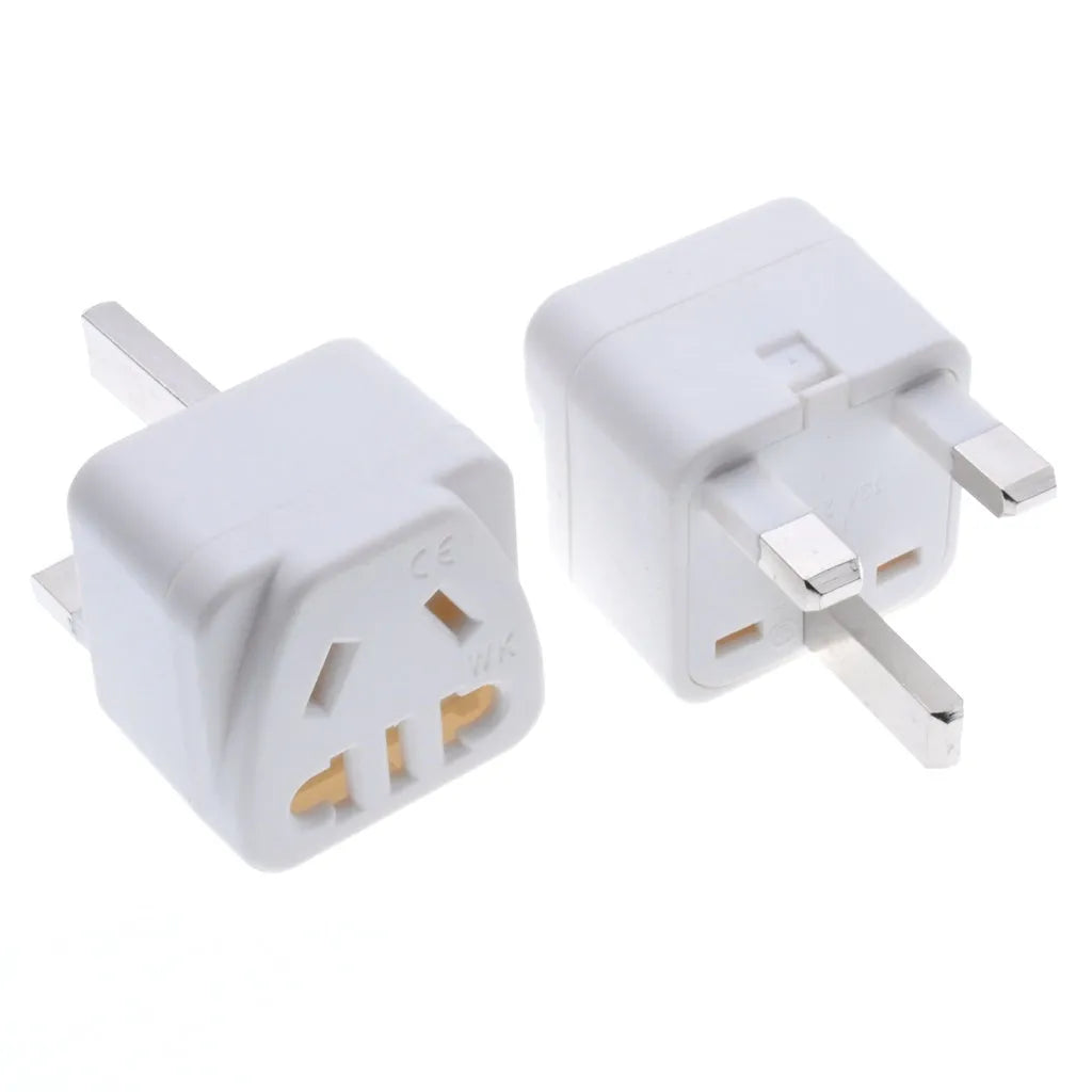 White square universal travel adapter with UK three-pin plug and five international output sockets.