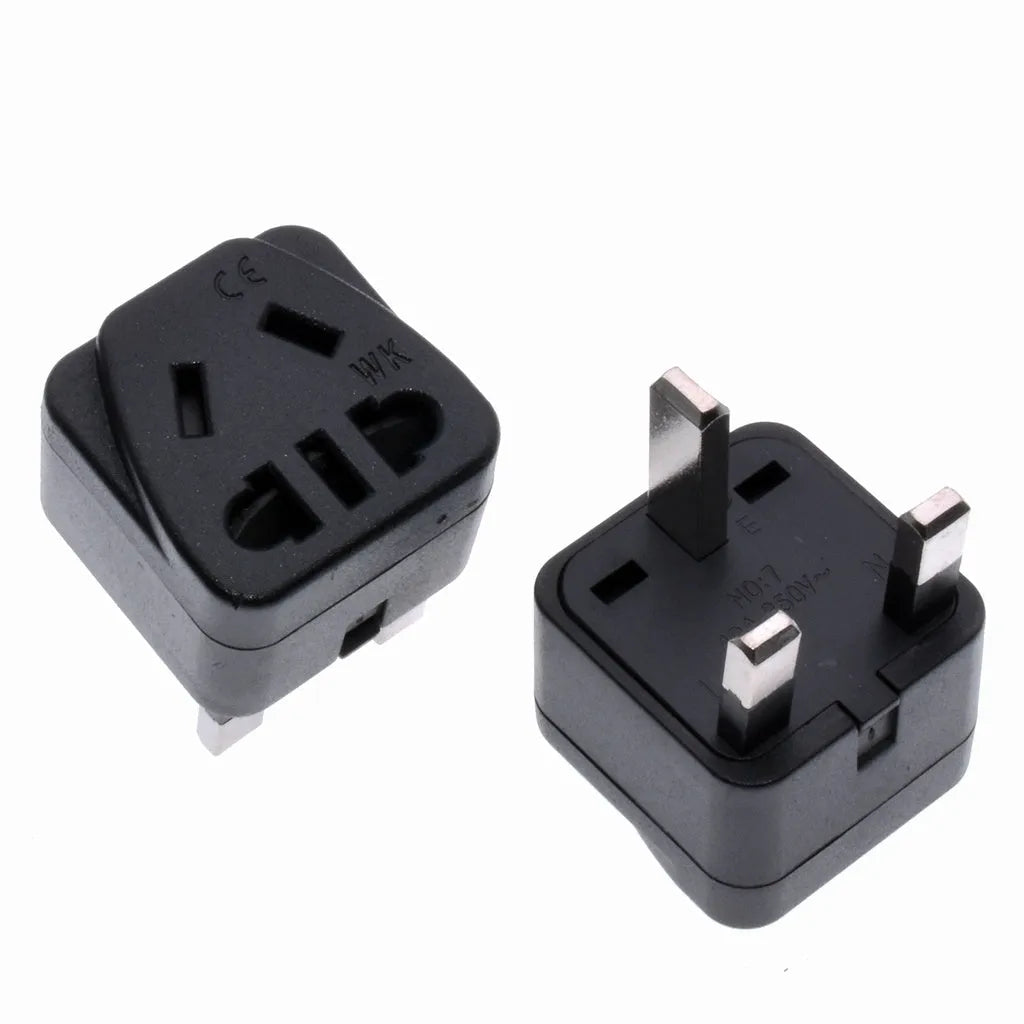 White square universal travel adapter with UK three-pin plug and five international output sockets.