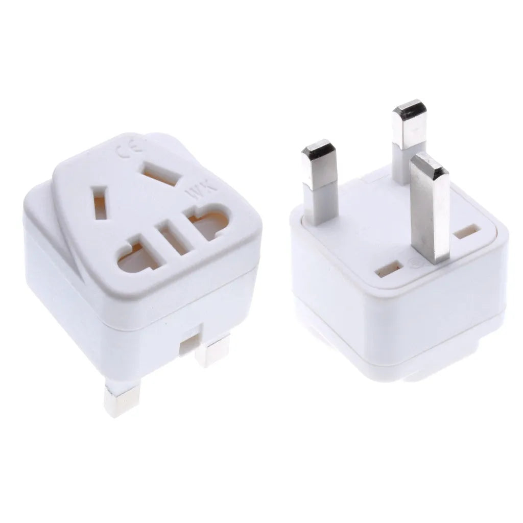 White square universal travel adapter with UK three-pin plug and five international output sockets.