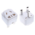 White square universal travel adapter with UK three-pin plug and five international output sockets.