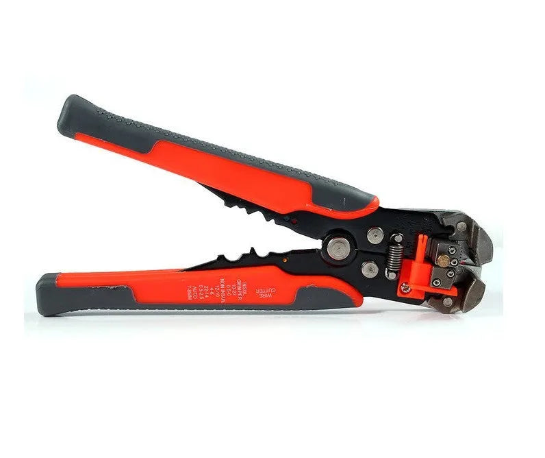 Yellow automatic 3-in-1 wire stripper, crimper, and cutter tool on a workbench.