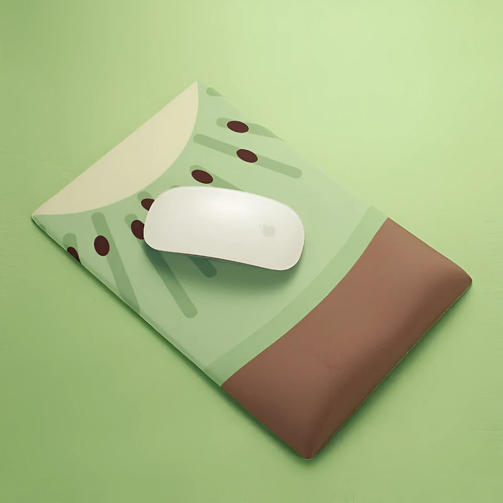 Green kiwi-shaped mouse pad with integrated wrist support and printed calculator numbers on cloth surface.