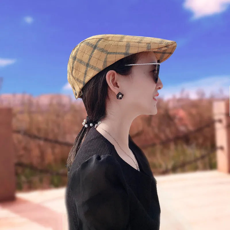 Cotton peaked cap with grid pattern, short brim, and tapered top in navy blue