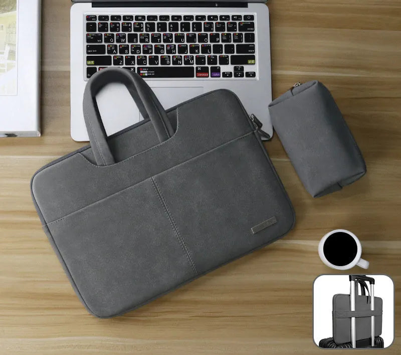 Blue PU leather laptop shoulder bag open to show internal padded computer pocket and organising compartments.