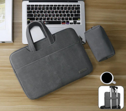 Blue PU leather laptop shoulder bag open to show internal padded computer pocket and organising compartments.