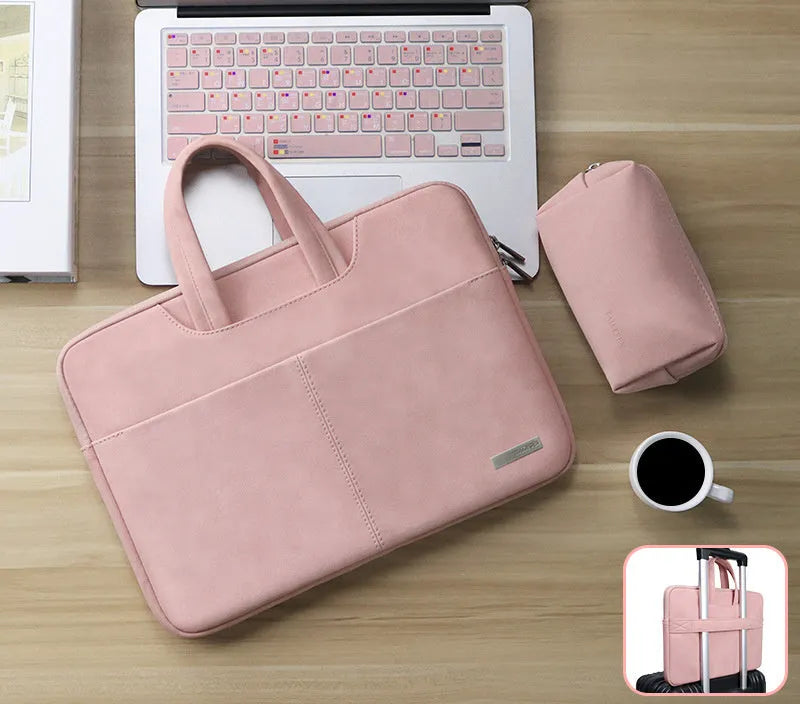 Blue PU leather laptop shoulder bag open to show internal padded computer pocket and organising compartments.