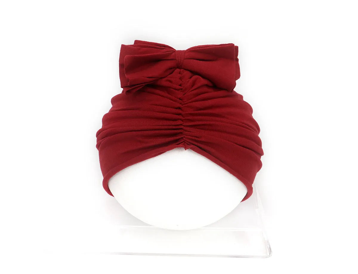 Soft knitted acrylic baby girl turban hat in solid colour, fits head sizes 35-48cm for ages 0-28 months