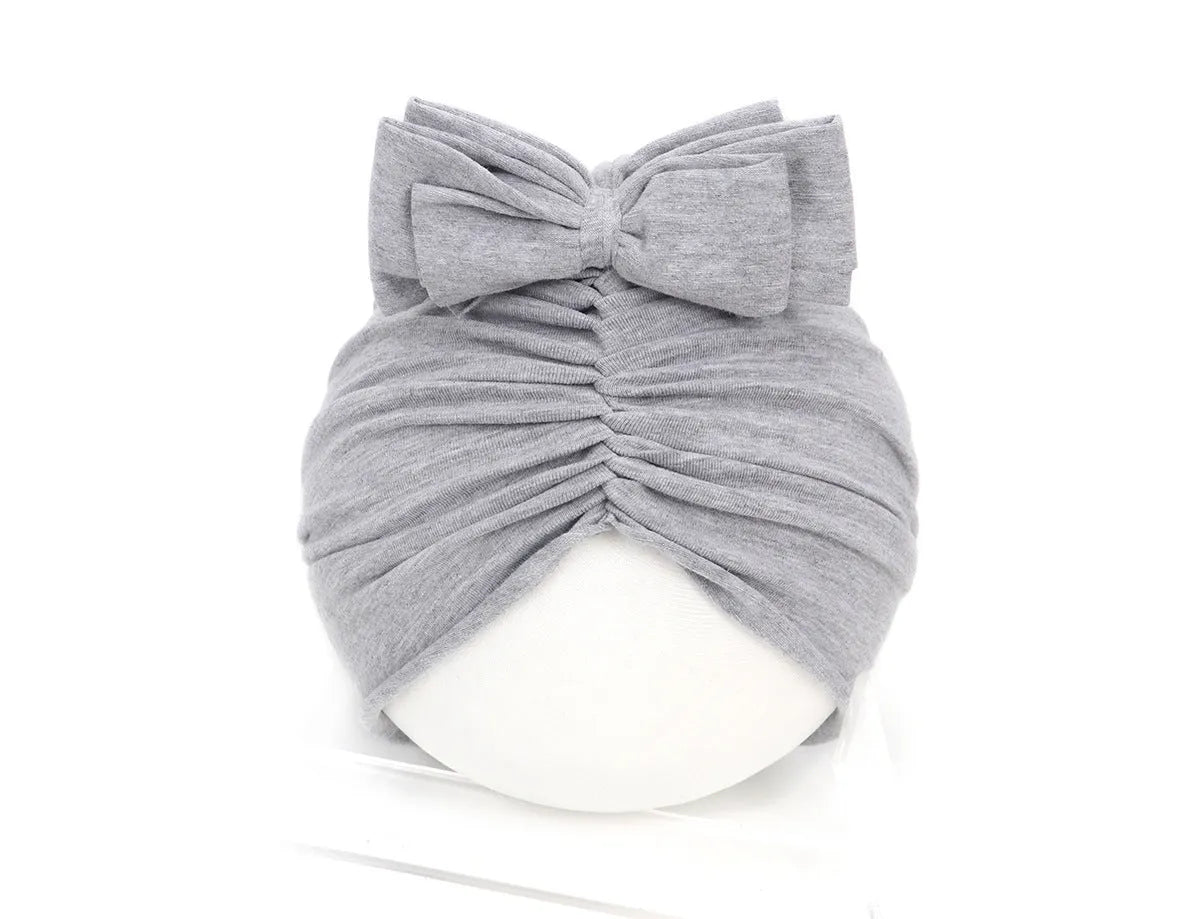 Soft knitted acrylic baby girl turban hat in solid colour, fits head sizes 35-48cm for ages 0-28 months