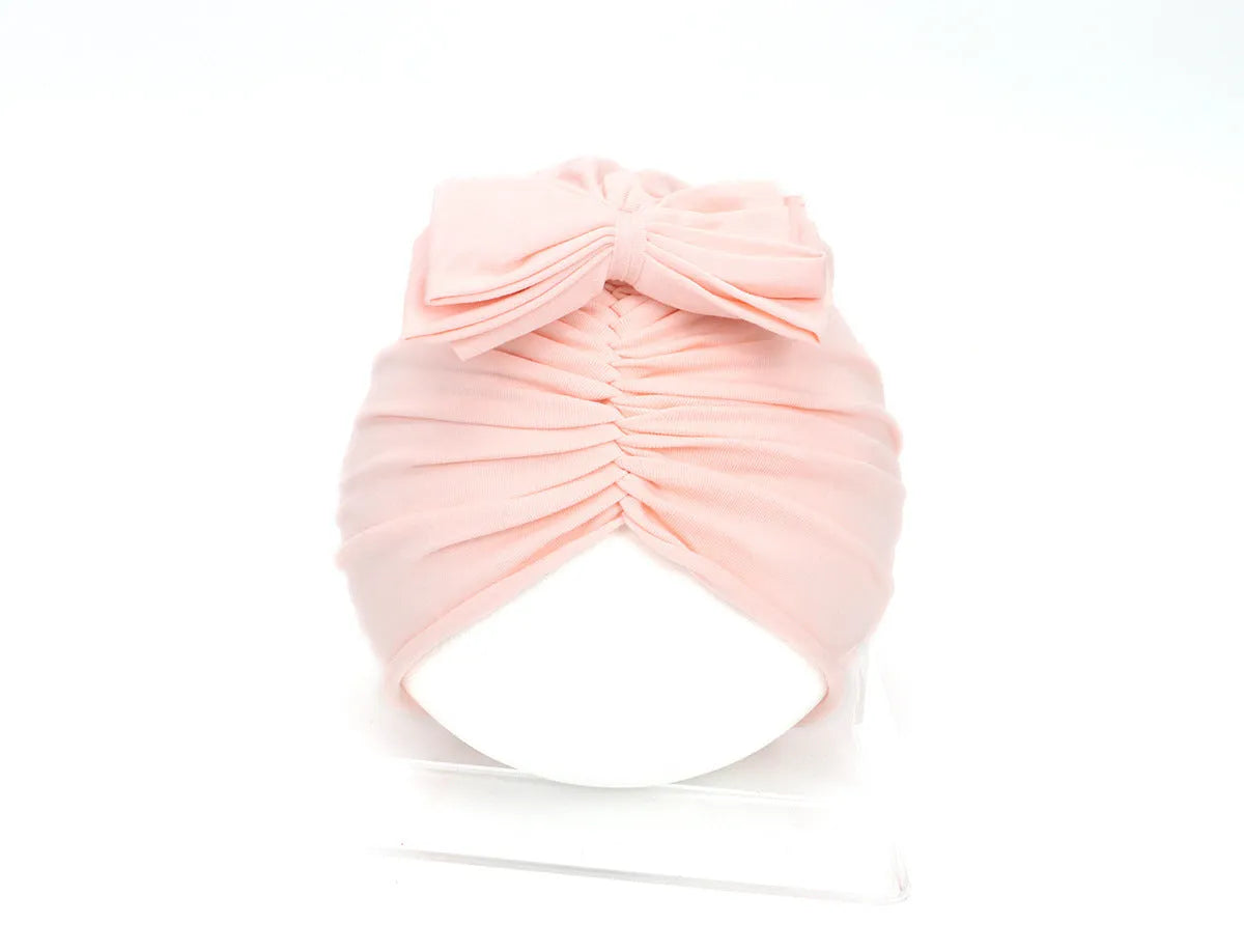 Soft knitted acrylic baby girl turban hat in solid colour, fits head sizes 35-48cm for ages 0-28 months