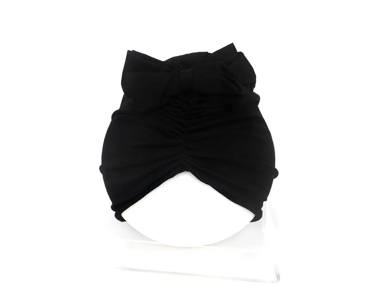 Soft knitted acrylic baby girl turban hat in solid colour, fits head sizes 35-48cm for ages 0-28 months