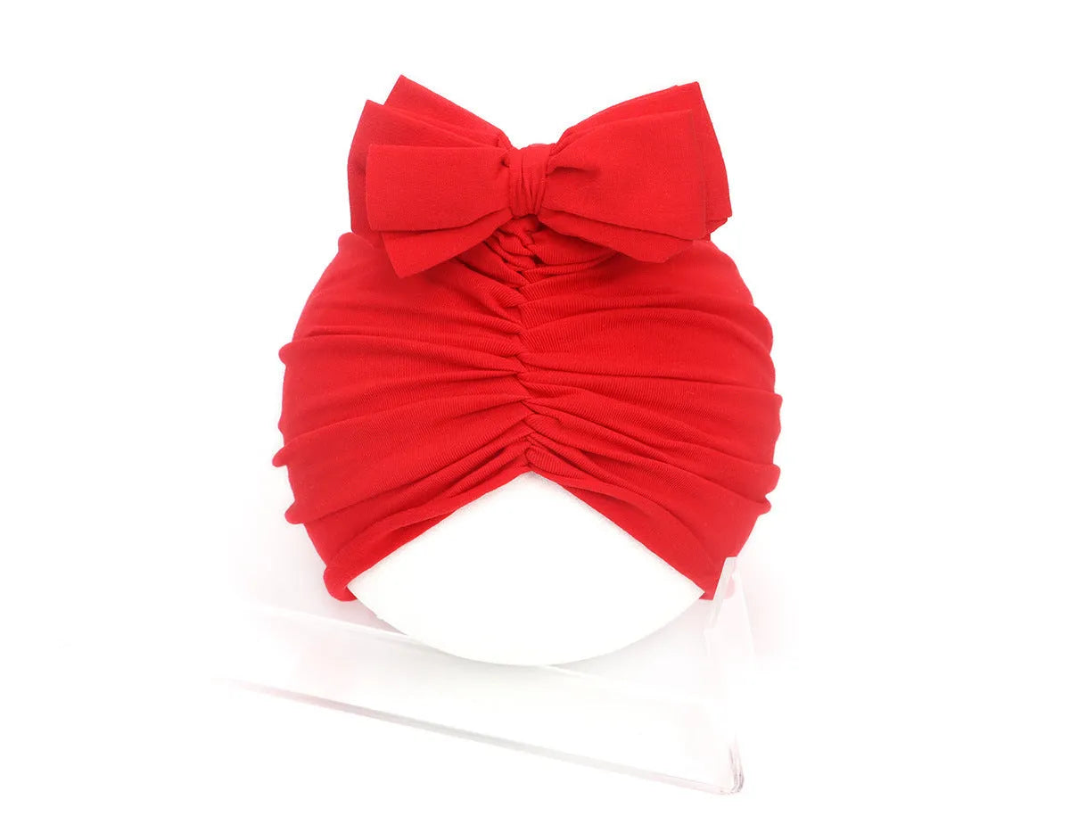 Soft knitted acrylic baby girl turban hat in solid colour, fits head sizes 35-48cm for ages 0-28 months