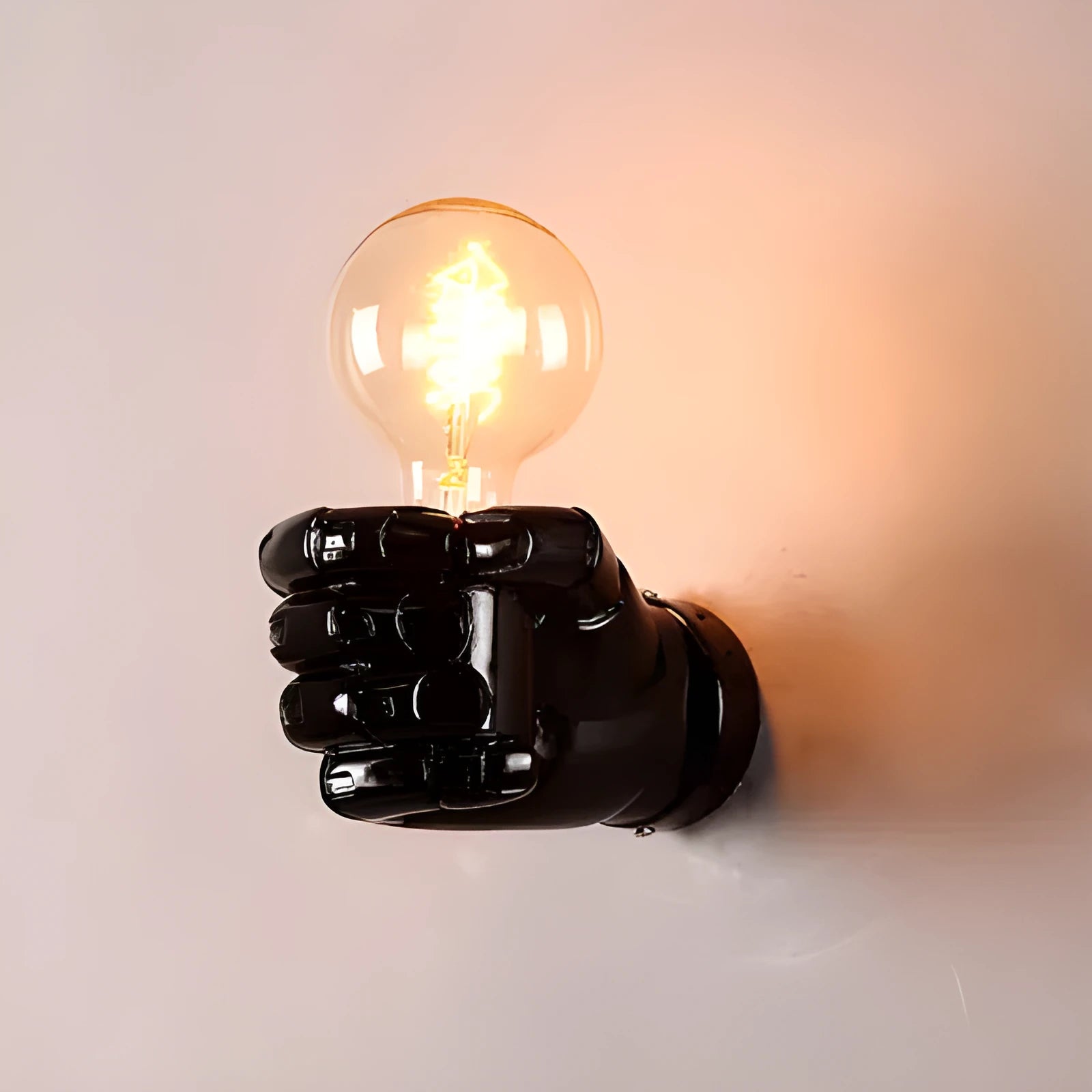 Industrial-style resin fist wall lamp in black, white, or wood grain finish for decorative lighting.