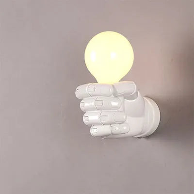 Industrial-style resin fist wall lamp in black, white, or wood grain finish for decorative lighting.