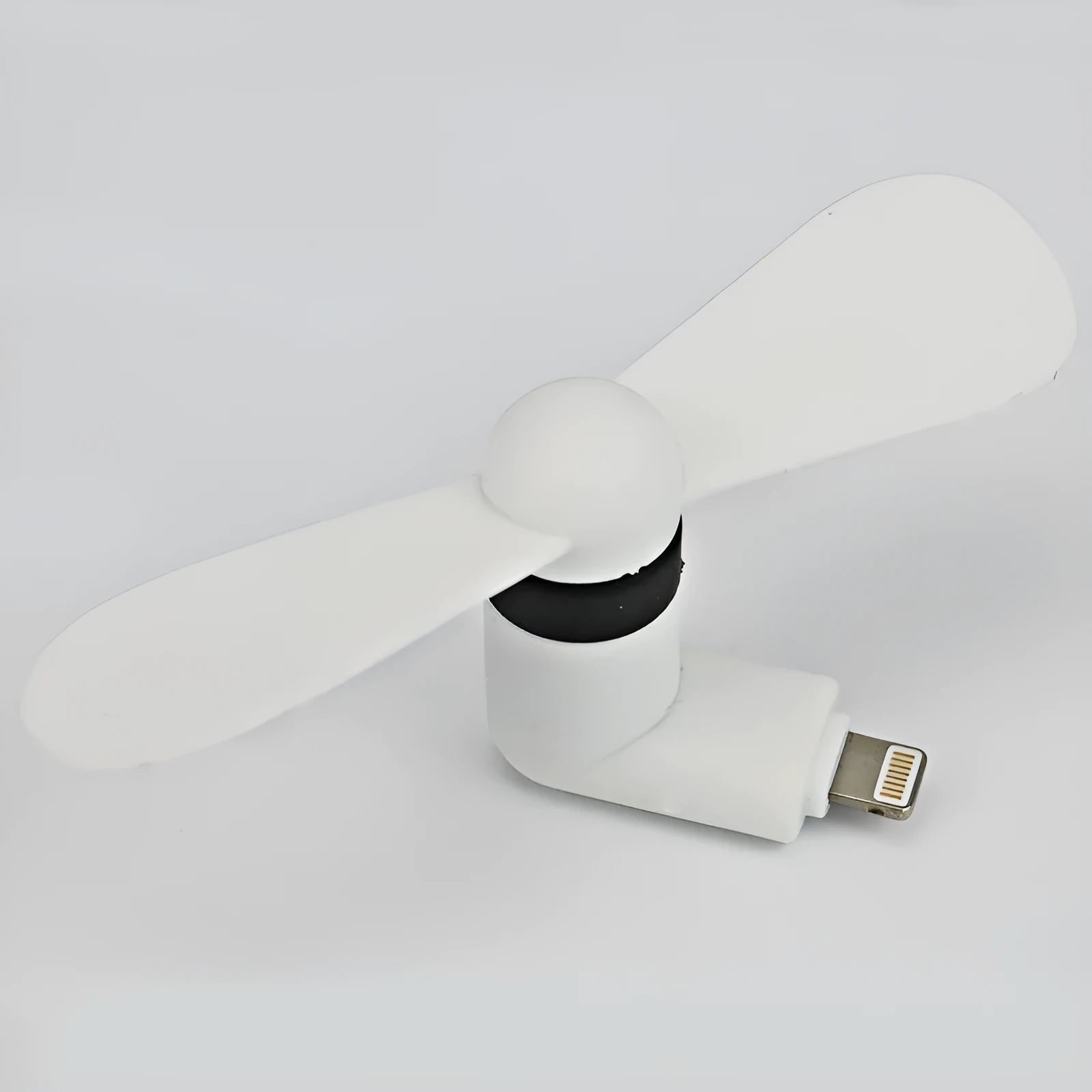 Portable mobile phone mini fan with plastic blades in various colours attached to smartphone