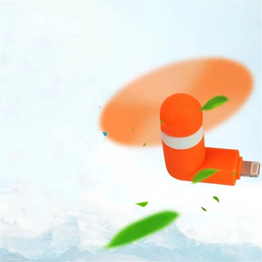 Portable mobile phone mini fan with plastic blades in various colours attached to smartphone