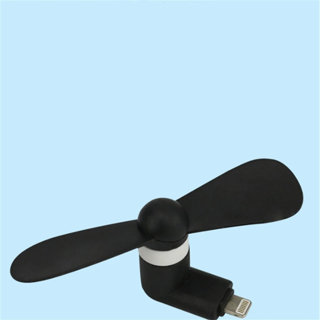 Portable mobile phone mini fan with plastic blades in various colours attached to smartphone