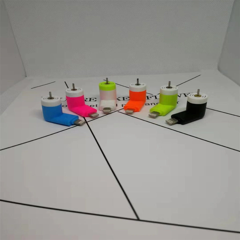 Portable mobile phone mini fan with plastic blades in various colours attached to smartphone