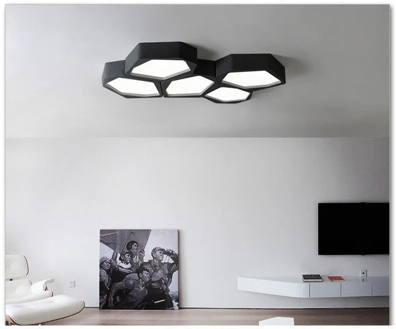 Geometric shaped LED wall light with asymmetric iron frame in black or white colour options