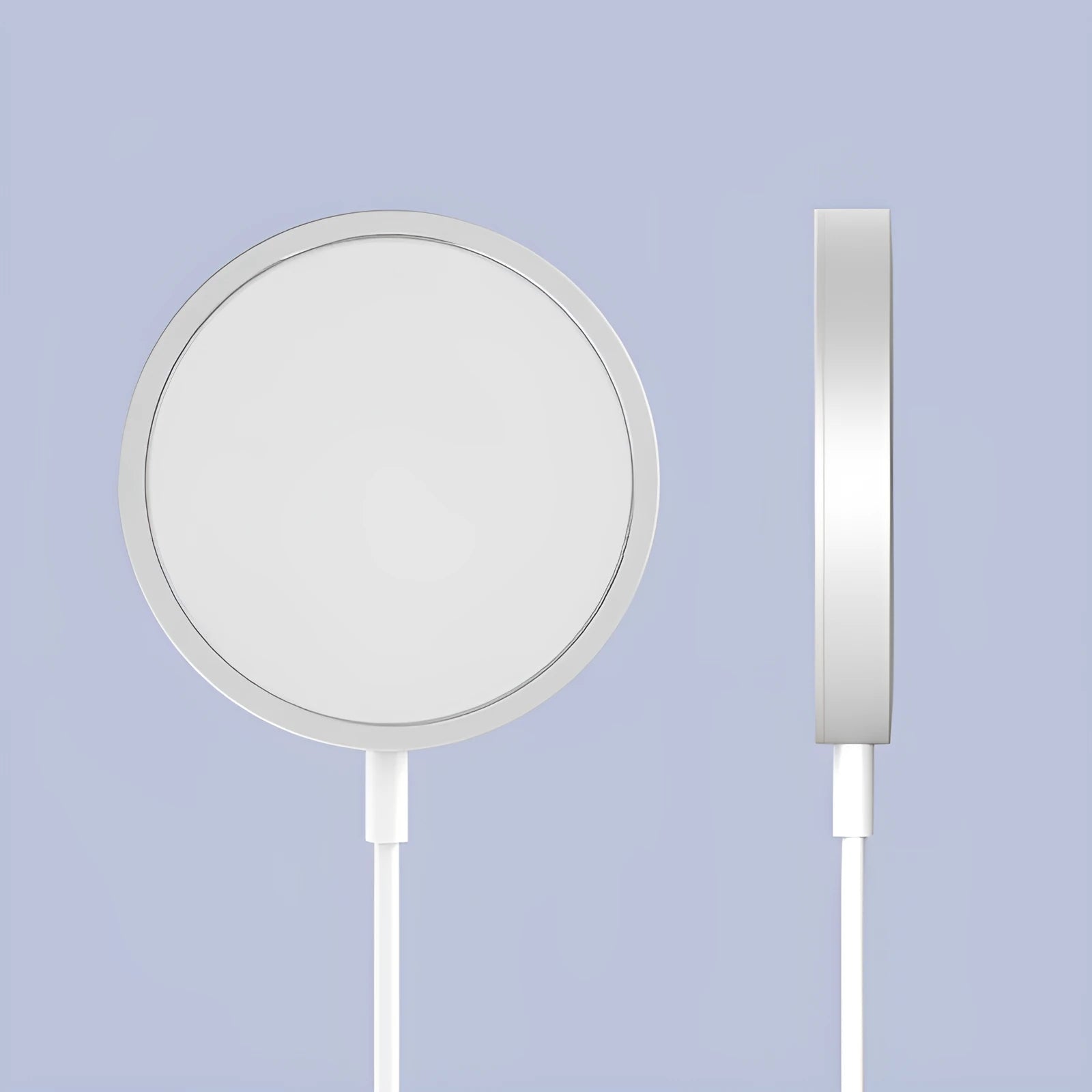 Silver metal Magsafe wireless charger for iPhone on a desk.