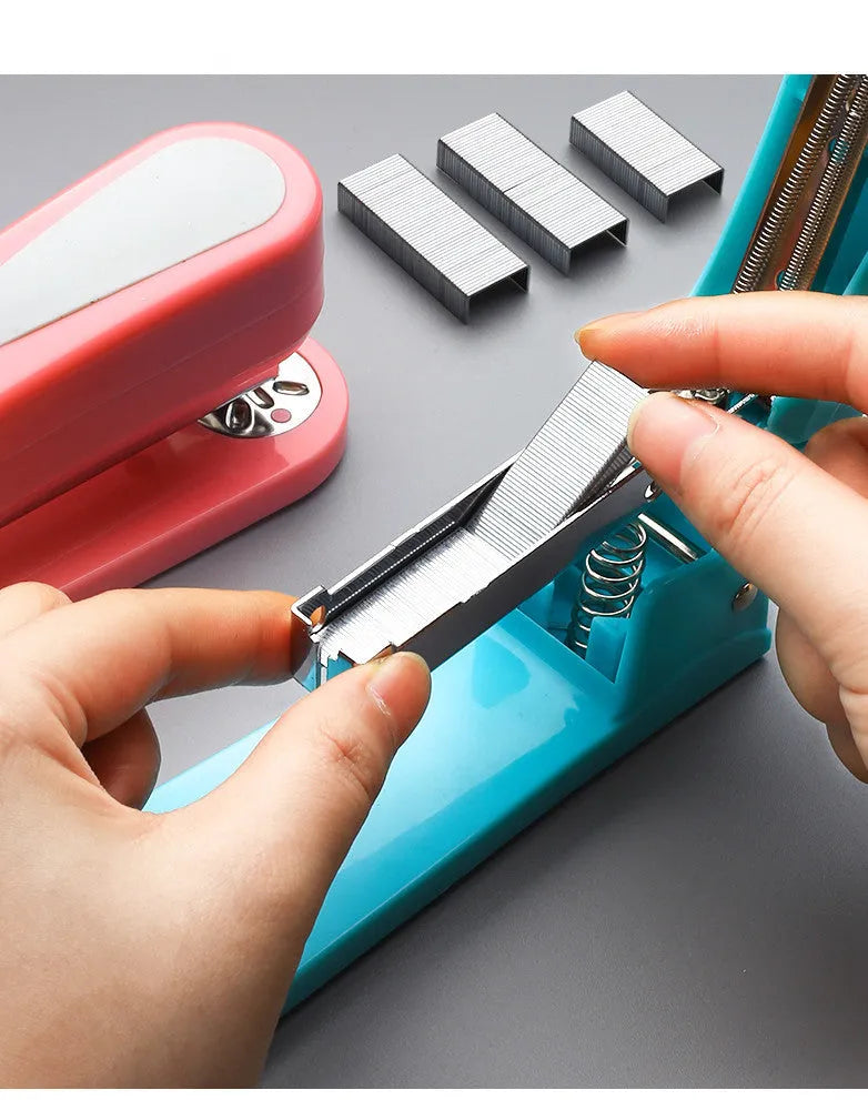 Rotating student stapler in multiple colours showing 360-degree head and centre binding function.