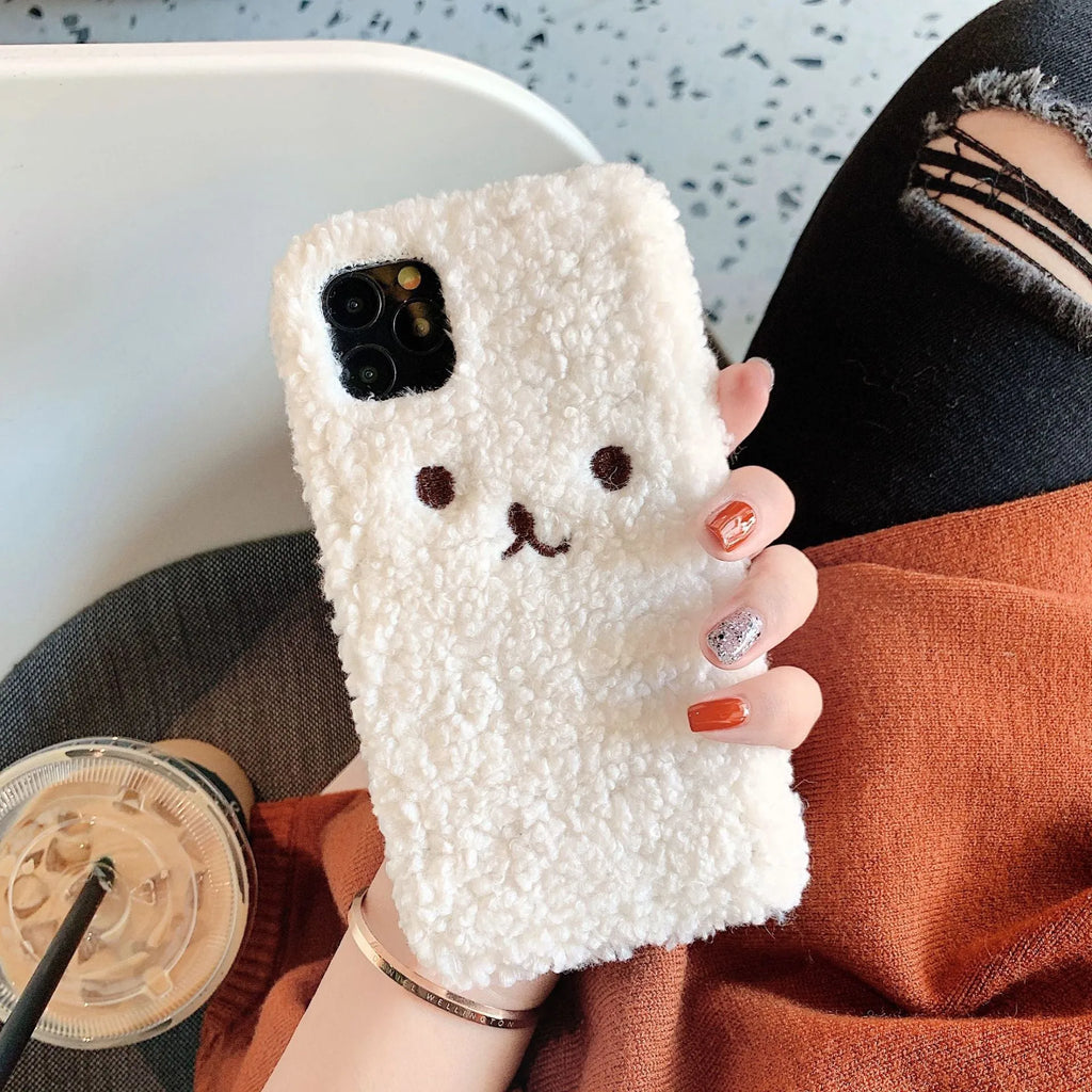 Brown embroidered plush cartoon bear face on a soft TPU iPhone case