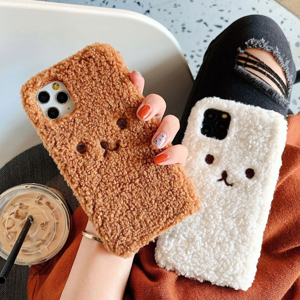 Brown embroidered plush cartoon bear face on a soft TPU iPhone case