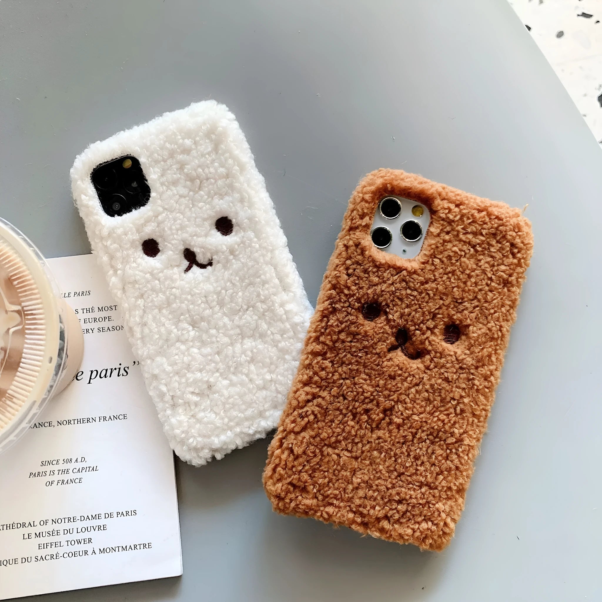 Brown embroidered plush cartoon bear face on a soft TPU iPhone case