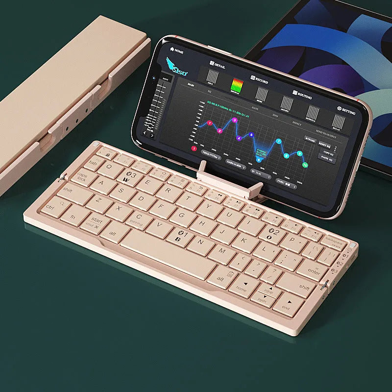 Silver aluminium folding Bluetooth keyboard open with phone on stand next to folded size comparison