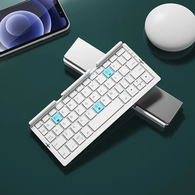 Silver aluminium folding Bluetooth keyboard open with phone on stand next to folded size comparison