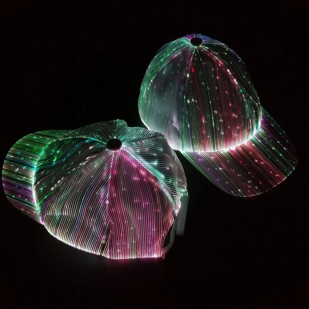 White luminous baseball cap with fibre optic fabric and LED glow against dark background