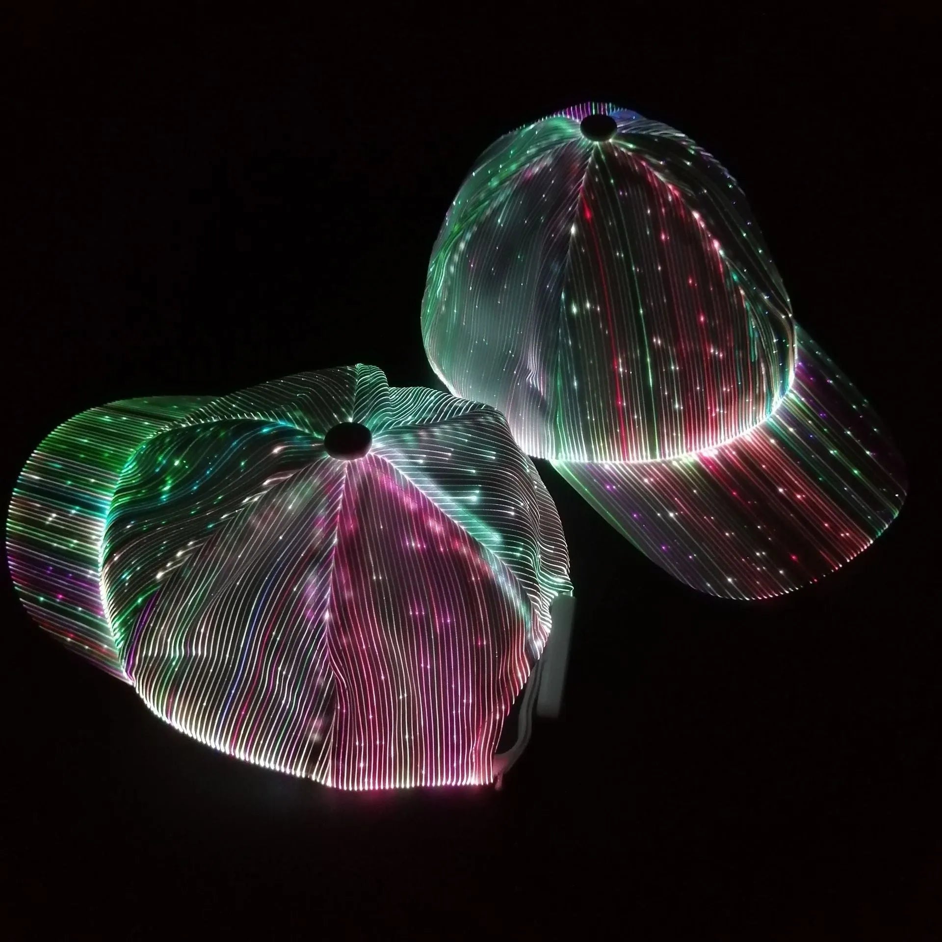 White luminous baseball cap with fibre optic fabric and LED glow against dark background