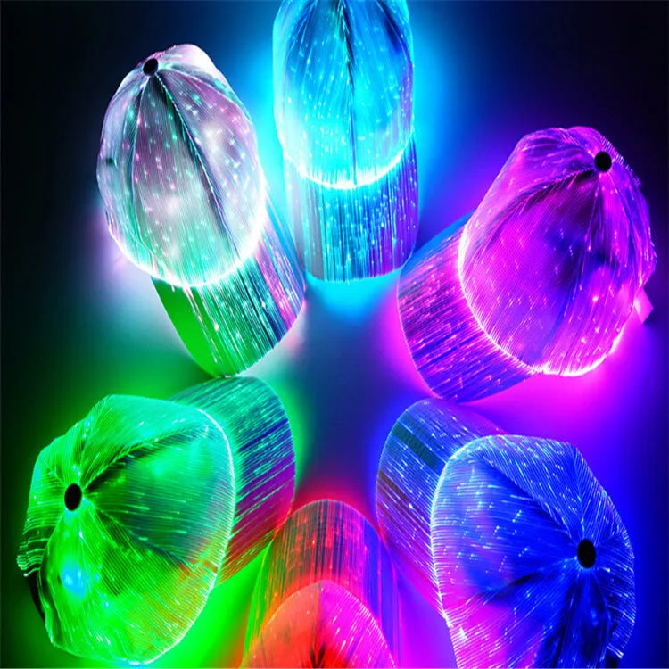 White luminous baseball cap with fibre optic fabric and LED glow against dark background