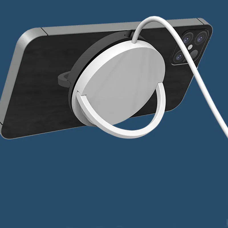 Black magnetic wireless charging bracket holding a mobile phone at an angle