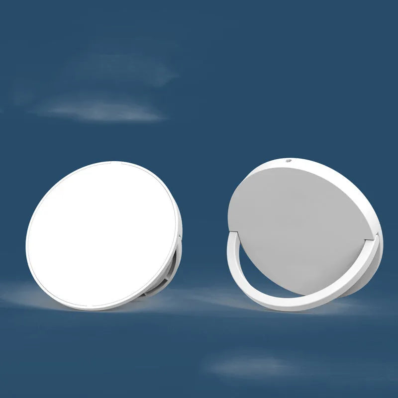 Black magnetic wireless charging bracket holding a mobile phone at an angle
