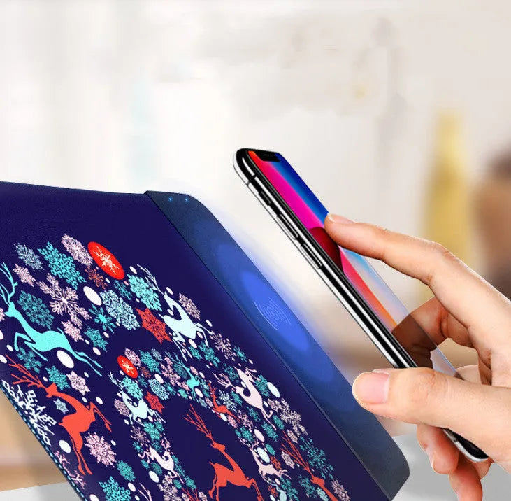 Cartoon design wireless charging mouse pad with RGB lighting on a desk