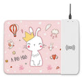Cartoon design wireless charging mouse pad with RGB lighting on a desk