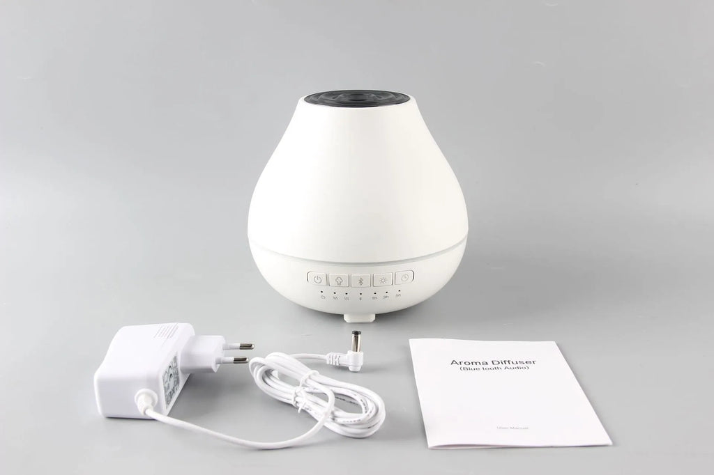 White round Bluetooth humidifier and aroma diffuser with night light and speaker