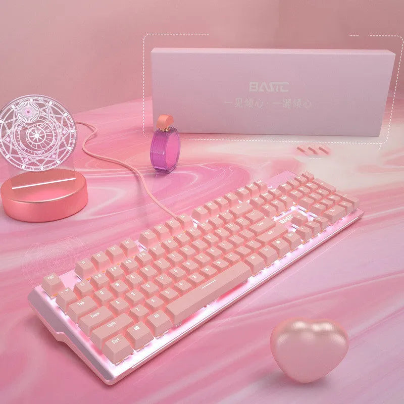 Pink mechanical keyboard and wired gaming mouse set on a desk.