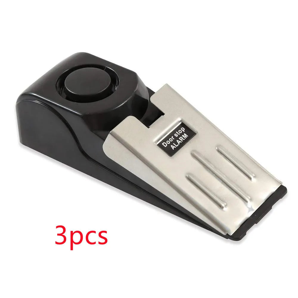 Electronic burglar alarm wedge door stop with ABS housing and 150dB siren on white background