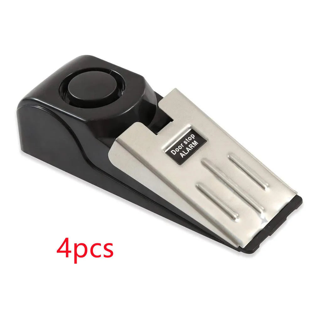 Electronic burglar alarm wedge door stop with ABS housing and 150dB siren on white background