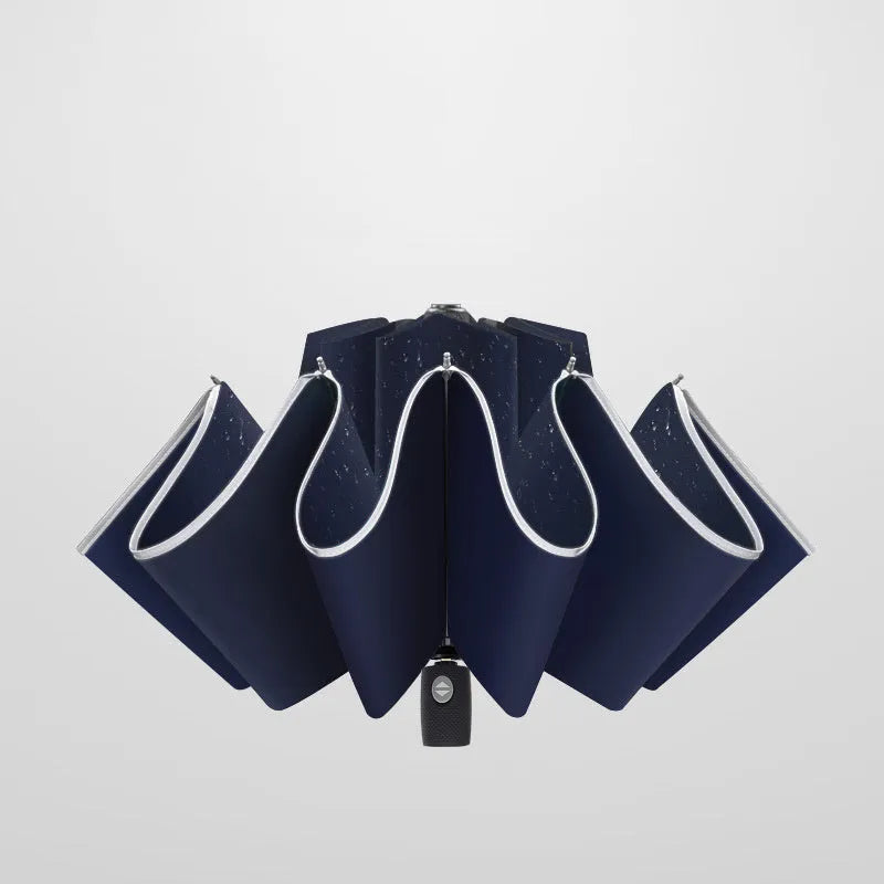 Automatic reverse folding umbrella with black canopy, plastic handle, shown open and closed.