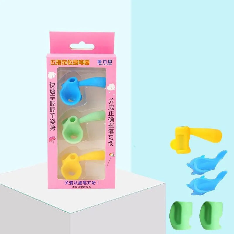 Dolphin-shaped pen holder orthosis for children in mixed colours, shown with a writing corrector.