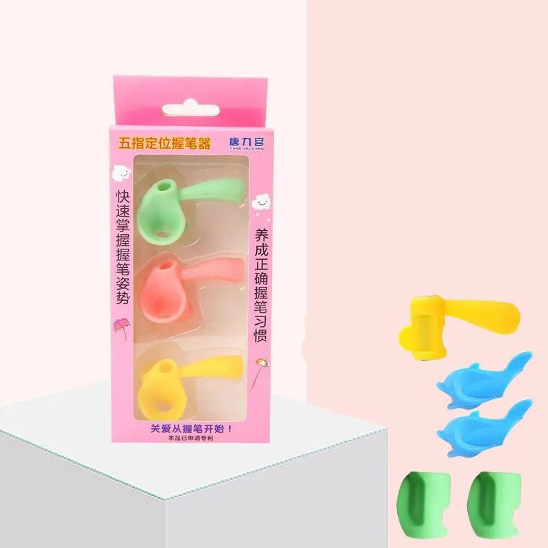 Dolphin-shaped pen holder orthosis for children in mixed colours, shown with a writing corrector.