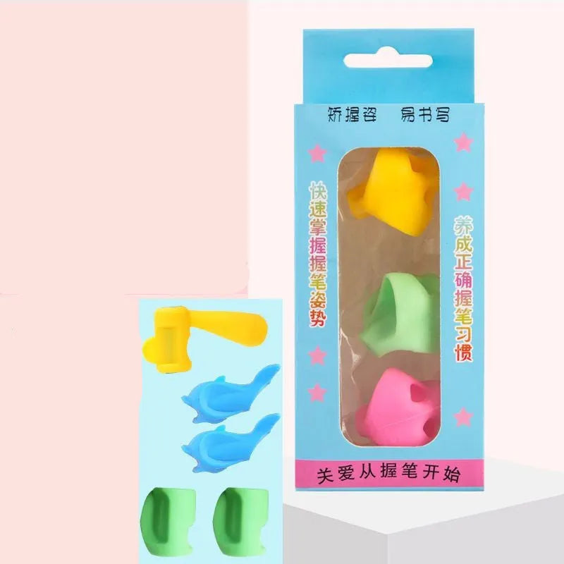 Dolphin-shaped pen holder orthosis for children in mixed colours, shown with a writing corrector.