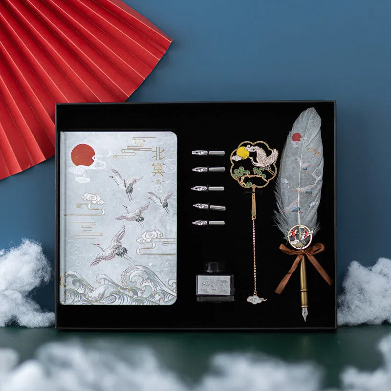 Chinese feather pen set with 36 quills in metal case and notebook.